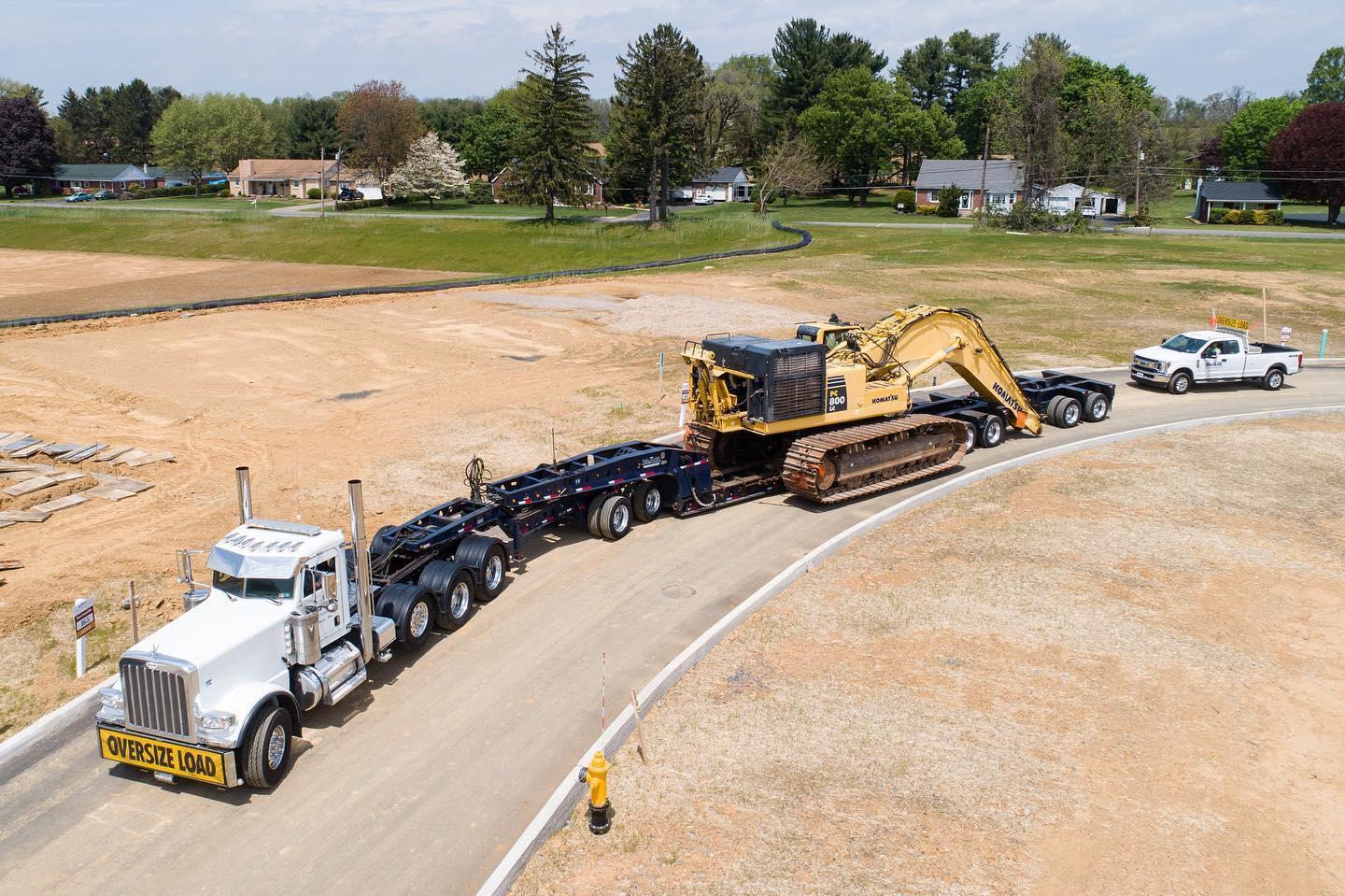 B. Blair aerial view oversize load transport with escort vehicle