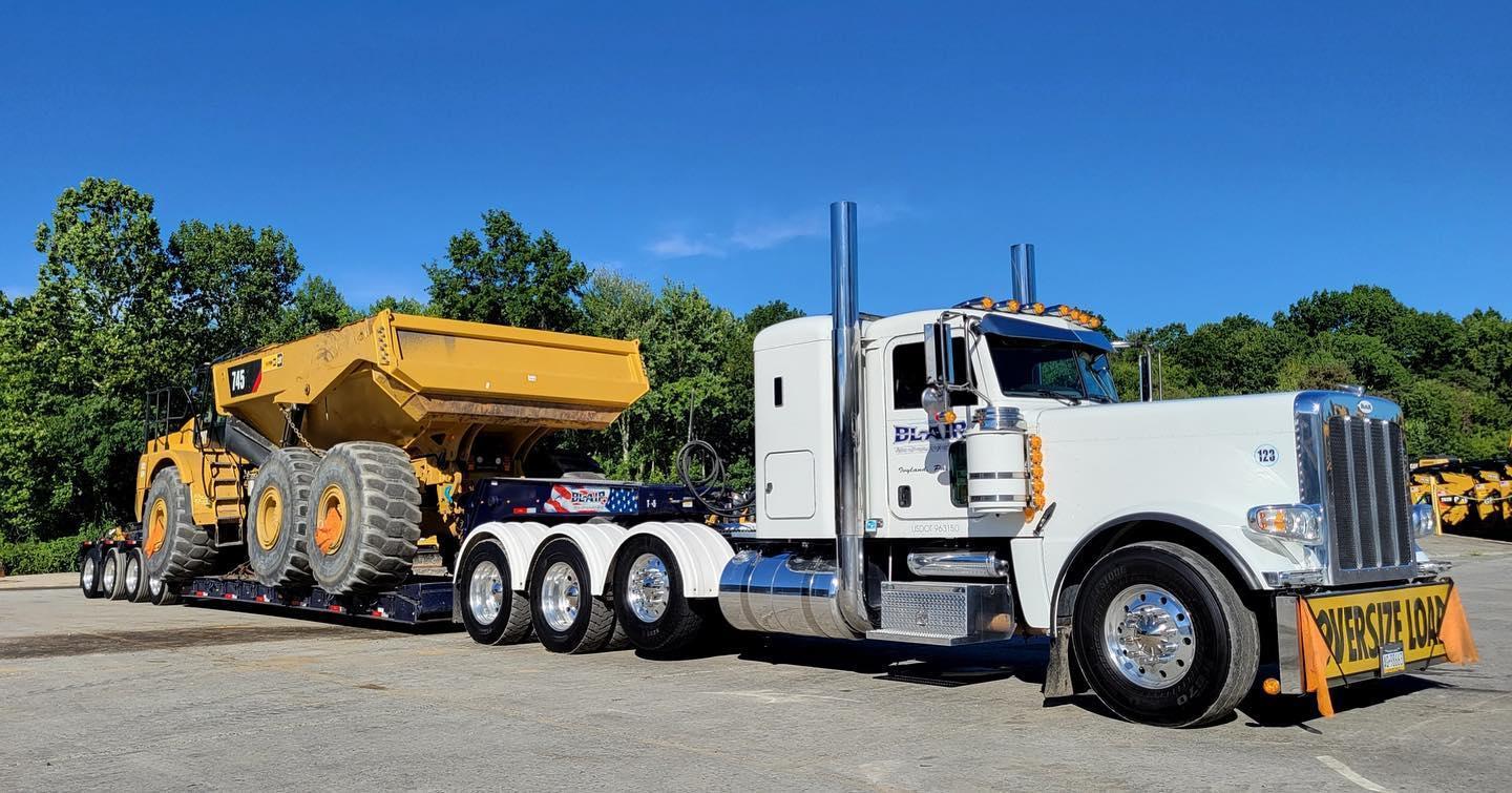 B. Blair heavy haul truck with CAT articulated dump truck on lowboy trailer