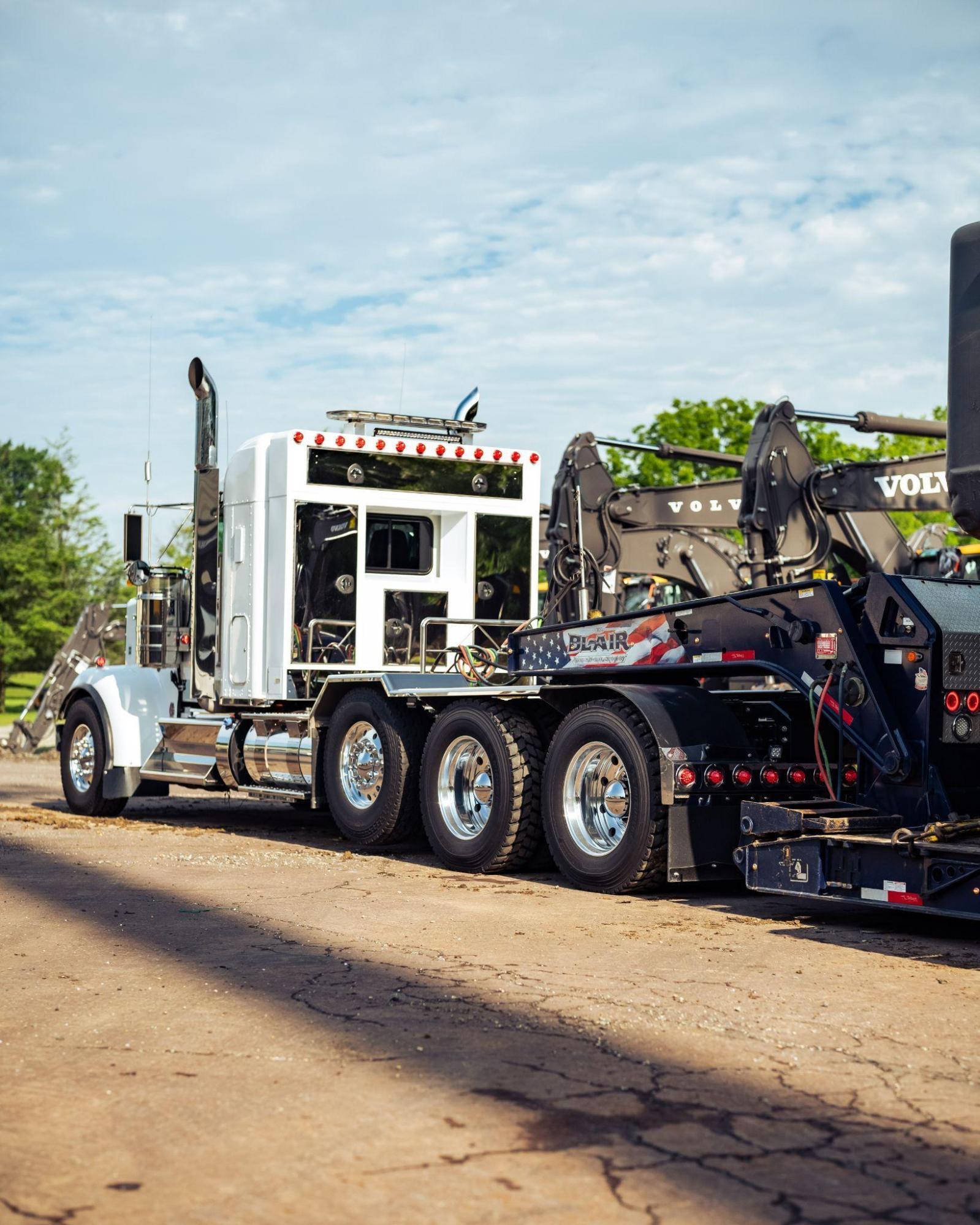B. Blair truck with Volvo excavator on lowboy trailer